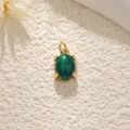Gold-plated planet pendant with large oval dark green crystal and polished finish - Malachite