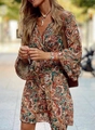 Close-up of bohemian V-neck dress featuring earthy paisley print and flared sleeves - S / Top And Bottom / Brown