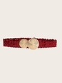 Dettaglio di una cintura larga in paillettes rosse con fibbia circolare in metallo oro - Rosso