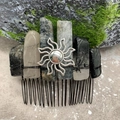 Detailed view of natural crystal stones and silver sun charm on a handcrafted hair comb - Black Rutilated Quartz Black Wire Silver Sun