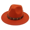 Detail of burnt orange felt fedora featuring leather band and metallic shell ornaments - Caramel color