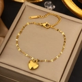 Detail of a gold heart pendant bracelet with adjustable chain on a jewelry display box - Gold Minimalist Heart Fine Chain (LM710)