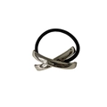Macro detail of elastic black hair tie with polished silver cross-design metal cuff - Silver Cross