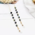 Elegant gold metal eyewear chain with dark faceted iridescent beads for women - Black/Green Glow Crystal