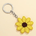Porte-clés marguerite bohème avec perles jaunes et marron sur un anneau en métal argenté - Tournesol