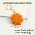 Star-shaped orange PVC cookie keychain charm measuring 5cm with a silver metal ring - Small Cream Cookie Keychain