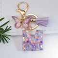 Letter M keychain with purple glitter, butterfly pendant and lavender leather tassel - Letter M