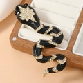 Retro snake brooch with black enamel and sparkling rhinestones on a wooden tray - Black (WBR282)