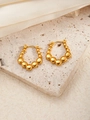 Macro shot of gold hoop earrings with beaded gradient design on white stone surface - Graduated Bead Hoop Earrings