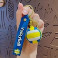 Blue and yellow volleyball keychain charm with silicone strap and gold lobster clasp - Volleyball
