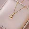 Elegant gold titanium steel necklace with rotatable star and moon pendant and cubic zirconia - X2038 Star Moon Rotating