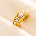 Macro detail of gold braided open ring featuring three white marble stones on satin fabric - Gold-White Turquoise