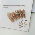 Close-up of 3x4mm champagne oval nail rhinestones applied on almond press-on nails - Champagne Oval 3x4 (XY-1018)