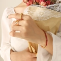Gold twisted ring and hollow band set with red gemstone bracelet on model hand - Red Zircon Bracelet-17cm