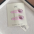 Lot de deux barrettes étoiles roses métallisées sur carton pour fillettes - Rose