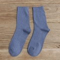 Fog blue mid-calf cotton socks with ribbed texture on vintage wood background - Denim Blue