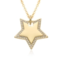 Detailed view of a gold star pendant with micro-pave zircons and mirror polished finish - Star Style (E272)