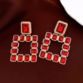 Macro shot of vintage style gold earrings with red rectangular gemstones and texture - 70# Silver Earring Post - Gold - Red - Red Square Gem Vintage Square