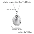 Detailed view of silver heart locket pendant dimensions 4.3x2.5cm with chain specifications - Stainless Steel / Vintage Carved Oval / Silver