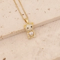 Macro view of gold teddy bear pendant with zirconia inlay and heart stone on cross chain - Full Zircon Blue Heart Bear (24#)