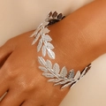 Detailed view of leaf textured silver bangle showing intricate layered foliage design - Silver Laurel Leaf Wraparound Bracelet (29)