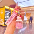 Detail of Hello Kitty liquid glitter keychain with pink Unicorn strap and golden bell - Pink Luminous Big Belly Cup