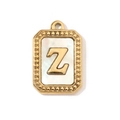Detailed macro of gold plated rectangle pendant featuring white shell and letter Z - Letter Z