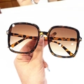Macro detail of square tortoiseshell sunglasses with gradient brown lenses and metal hinge - Tortoise Frame Gradient Tea