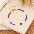 Detailed shot of bohemian beaded bracelet with blue heart stone and adjustable gold chain - Deep Blue/7# Lapis Lazuli