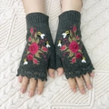 Detail shot of dark green knitted fingerless gloves with red rose and bee embroidery - One Size / Dark Gray
