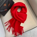 Vibrant red long wool scarf with soft tassels and woven label for winter styling - Wine Red