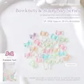 Macro shot of Aurora resin bow nail ornaments in SP-3968 packaging with 30 pieces - Bow (SP-3968)