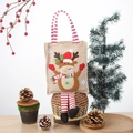 Bolsa de regalo de Navidad con reno 3D en arpillera marrón y asas rojas a rayas - Alce