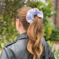 Handmade knitted blue and pink ruffled scrunchie hair tie on ponytail with soft texture - Blue with Pink Edge