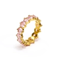 Detailed close-up of eternity band ring with pink cubic zirconia stones in gold plating - Gold Pink Zirconia
