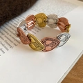 Detail of vintage heart-patterned elastic bracelet in gold, silver, and copper tones - 2# Three-Tone Heart Leaf Metal Patch Bracelet