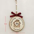 Wooden 2025 New Home ornament with laser-cut house design and buffalo plaid bow - Round 2025 House Silhouette