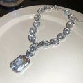 Detailed view of silver necklace featuring large clear zircon stones and rectangle pendant - Silver Oval Necklace