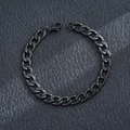 Detailed view of a sleek black cuban link bracelet made of durable stainless steel. - NK Chain Bracelet / Black