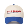 Detail of contrast embroidery text IT'S A BAD DAY TO BE A HOTDOG on baseball cap crown - Sapphire Blue