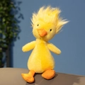 Soft yellow plush duck toy with fluffy head and orange beak on a neutral background - Yellow Fluffy Duck / 26cm