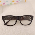 Kids black oversized sunglasses with silver stud rivets and UV protection on white fabric - Black Frame Clear Lenses