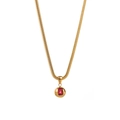 Detail of gold snake chain necklace with rectangular red gemstone pendant on white background - Red