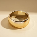 Macro view of wide thick-walled gold polished ring with minimalist round geometric shape - Large Polished Gold Round Bangle