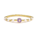 Hamsa Hand beaded bracelet with golden metal beads and white pearls on white background - Purple