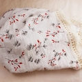 Close-up of double-layer cotton baby blanket with floral print and fringe details - Custom Size / Pink