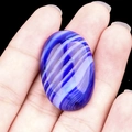 Polished blue lace agate oval cabochon stone with natural blue and white silk texture - Sapphire Blue Agate