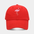 Detailed close-up of pink flamingo embroidery on a red cotton canvas baseball cap - Adjustable / Red