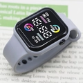 Gray digital sports watch with square dial and silicone strap showing fitness metrics - Gray