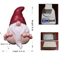 Handcrafted resin garden gnome ornament with red pointed hat and white beard in sitting pose - Big Foot Red Hat